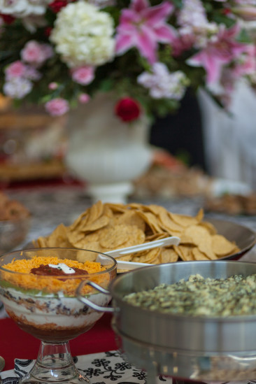 Lovely layered bean dip and spinach artichoke dip with a beautiful bouquet of flowers