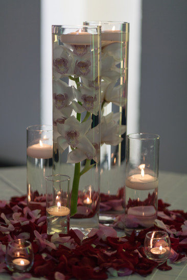Awesome table display of iris flowers and candles in crystal vases